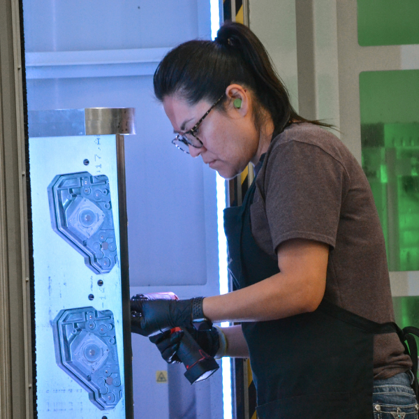 Machinist loads castings onto a fixture